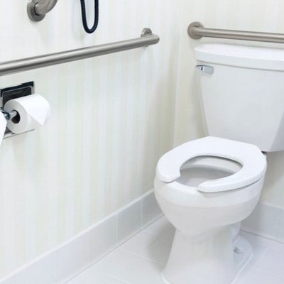 Toilet with grab bars.