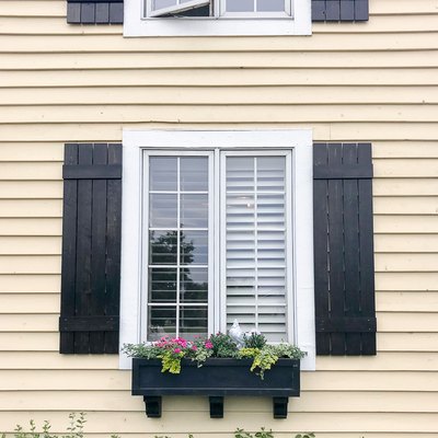 Black board and batten exterior shutter style on traditional Craftsman home
