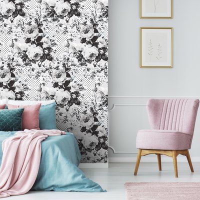bedroom with black-and-white floral wallpaper