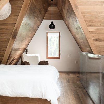 bedroom attic idea with wood ceiling and floors