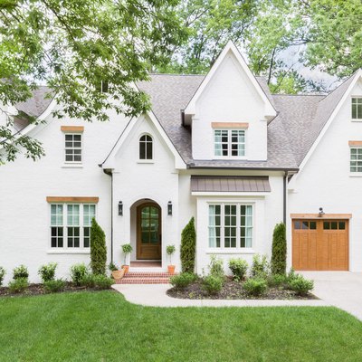 white home exterior house color for 2021 with farmhouse visuals and wood trim