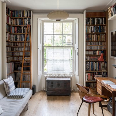 Home Office Built Ins with Floor-to-ceiling built-in library in London home on Modern Street