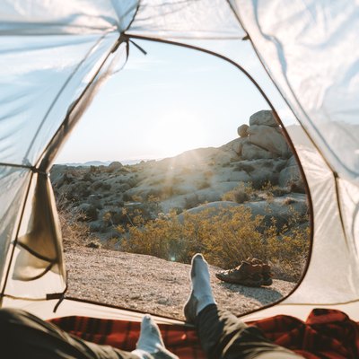 person in tent with view of nature
