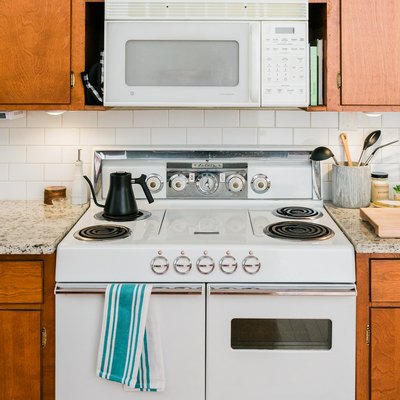 White electric stove in midcentury kitchen