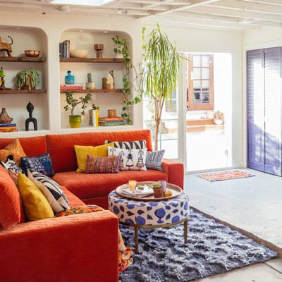 Garage Organization Tips and Tricks with orange couch and built-ins