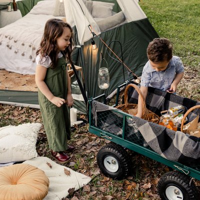 Kids next to tent camping or "glamping"