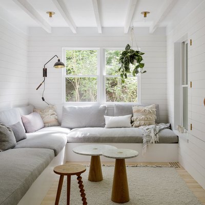 built-in living room sectional with gray seat and back cushions and a collection of throw pillows