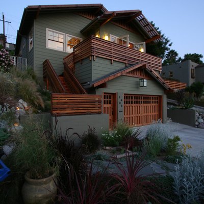 craftsman style garage door and green exterior