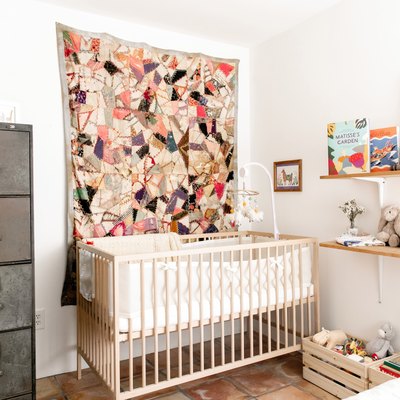 baby nursery idea with light wood furniture and industrial filing cabinet