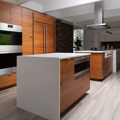 open kitchen with dark wood cabinetry and white countertops