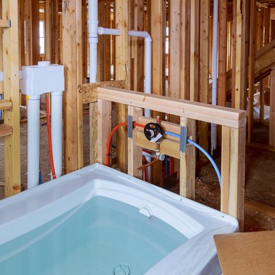 Bathroom unfinishing new home installation of plumbing, faucets, water and sewerage.