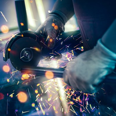 Sparks during cutting of metal part industrial grinder