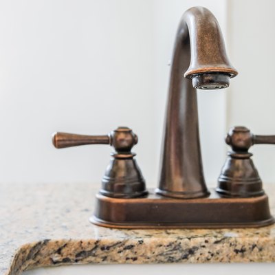 Bronze bathroom vanity faucet and sink