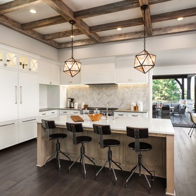 beautiful kitchen in new luxury home with island and pendant light fixtures