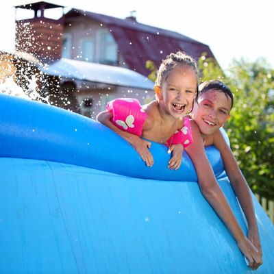 Kids having fun in a inflatable swimming pool
