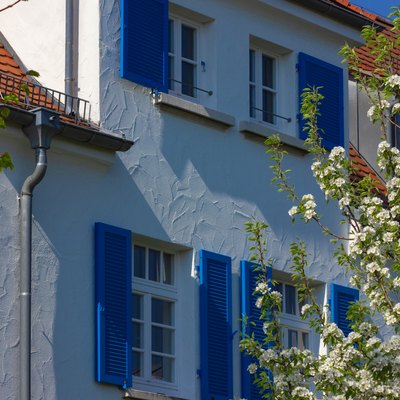 House facade, white and blue.