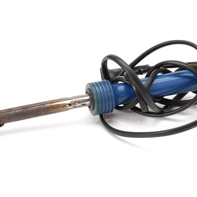 Soldering iron on the white background