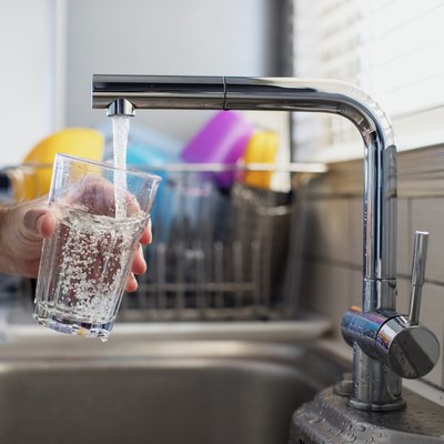 Man holding a glass of water