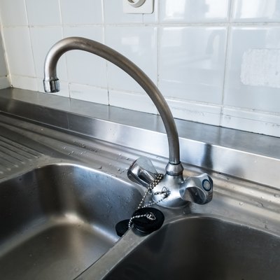 kitchen faucet on a stainless steel sink