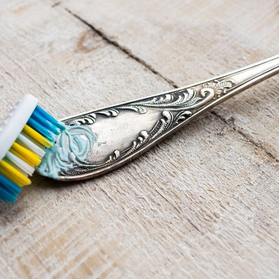 Cleaning the cutlery with a brush and paste. Cleaning Darkened silverware with Toothpaste or cleaning paste