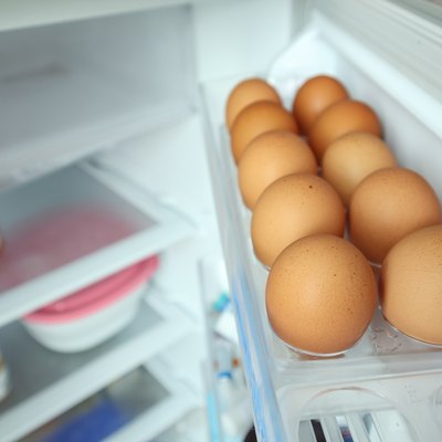 eggs arrange on refrigerator shelf