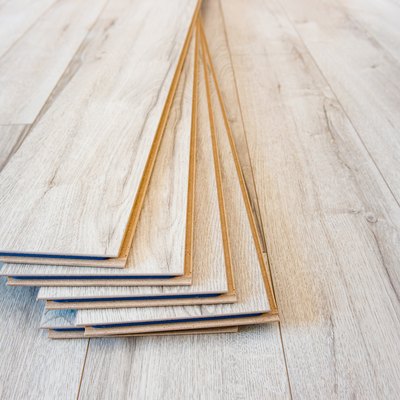 Light laminate on the floor with some laminate left after work