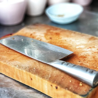 Meat cleaver on wooden board