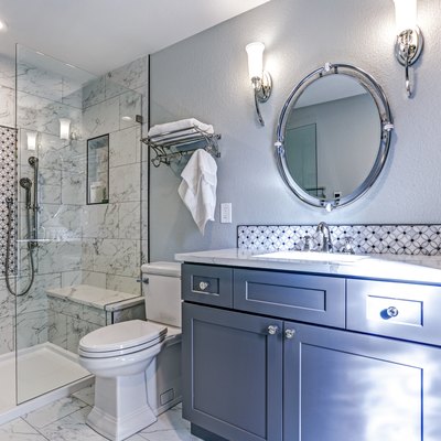 New blue bathroom design with Marble shower Surround