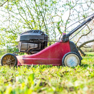 Close-Up Of Lawn Mower On Field
