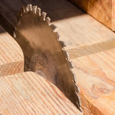 Circular saw blade for cutting wood closeup at selective focus