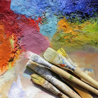 oil paints palette and paint brushes