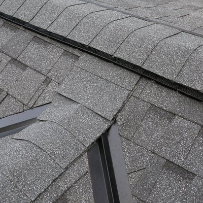 Shingled roof with peaks and valleys on the dormer