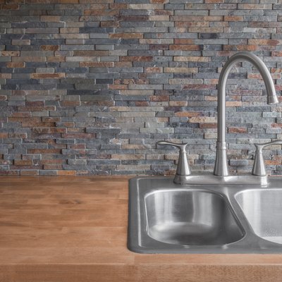 Wood Kitchen counter and stone backsplash tiles