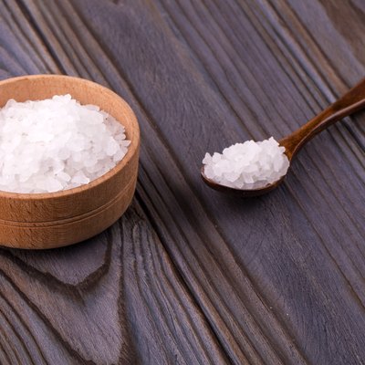 White bath salt in a wooden bow