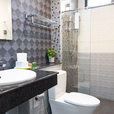 Modern bathroom interior with white toilet and shower