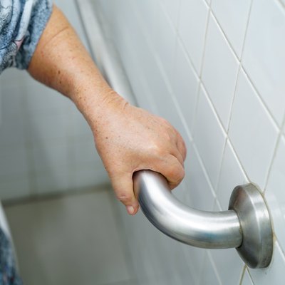 Asian senior or elderly old lady woman patient use shower handle security in nursing hospital ward : healthy strong medical concept.