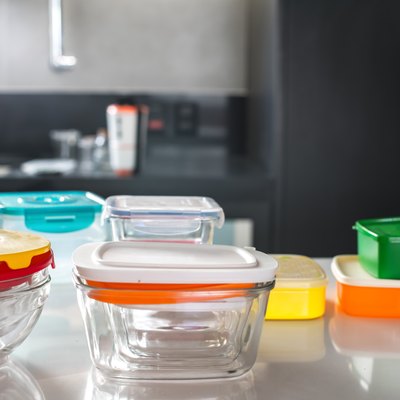 colorful plastic pots on top of kitchen counter