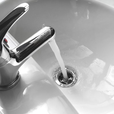 Faucet with Running Water in a Sink