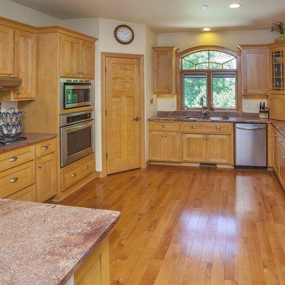 Spacious Custom Kitchen With Hardwood Floor, Cabinets, Marble Counters