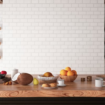 Kitchen Counter with Foods and Empty White Brick Wall