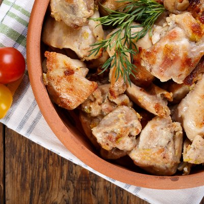 Roasted chicken meat pieces. Grilled boneless skinless chicken thigh. Top view.