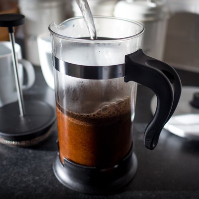 Hot water pouring into a French press coffee maker