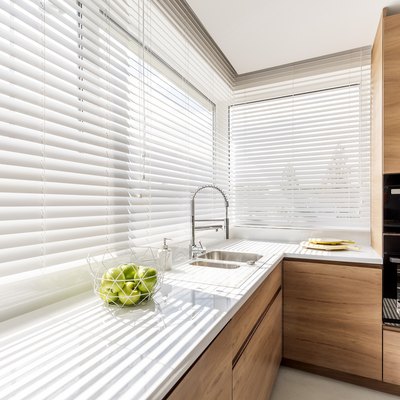 Kitchen with white window blinds