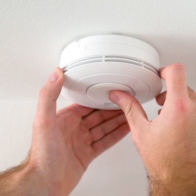 Man installing smoke detector