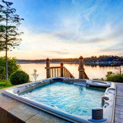 Awesome water view with hot tub in summer evening.