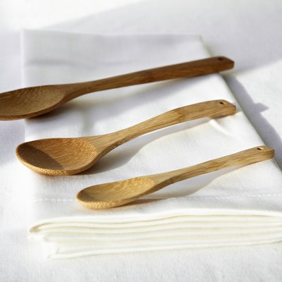 Wooden spoons on folded napkin