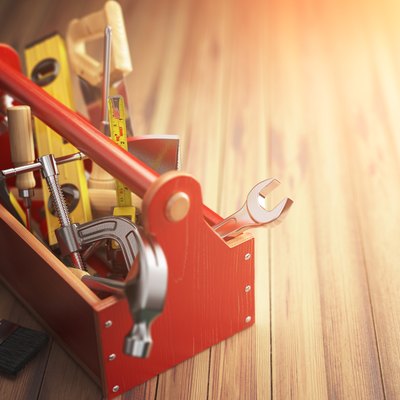 Support service concept. Toolbox with tools on wooden background