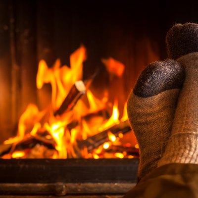 warming feet at fireplace
