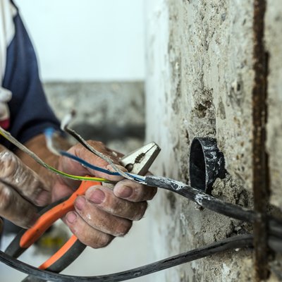 Photo of Hand striping the insulation of wires