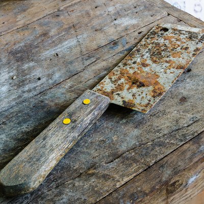 Old Rusty Kitchen Knife on dirty table